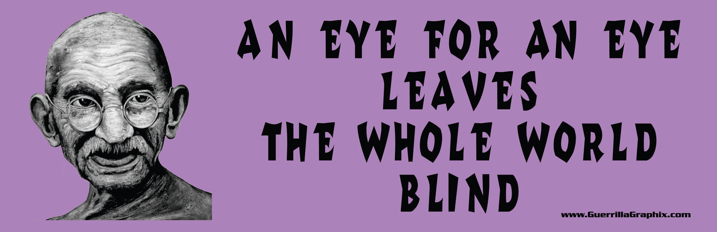 A paper sticker with a quote by Gandhi, 'An eye for an eye leaves the whole world blind', featuring his portrait and the text on a purple background.